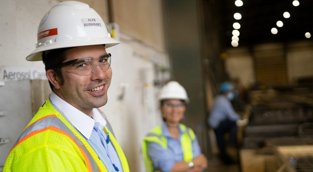 Smith Midland associates standing in the shop