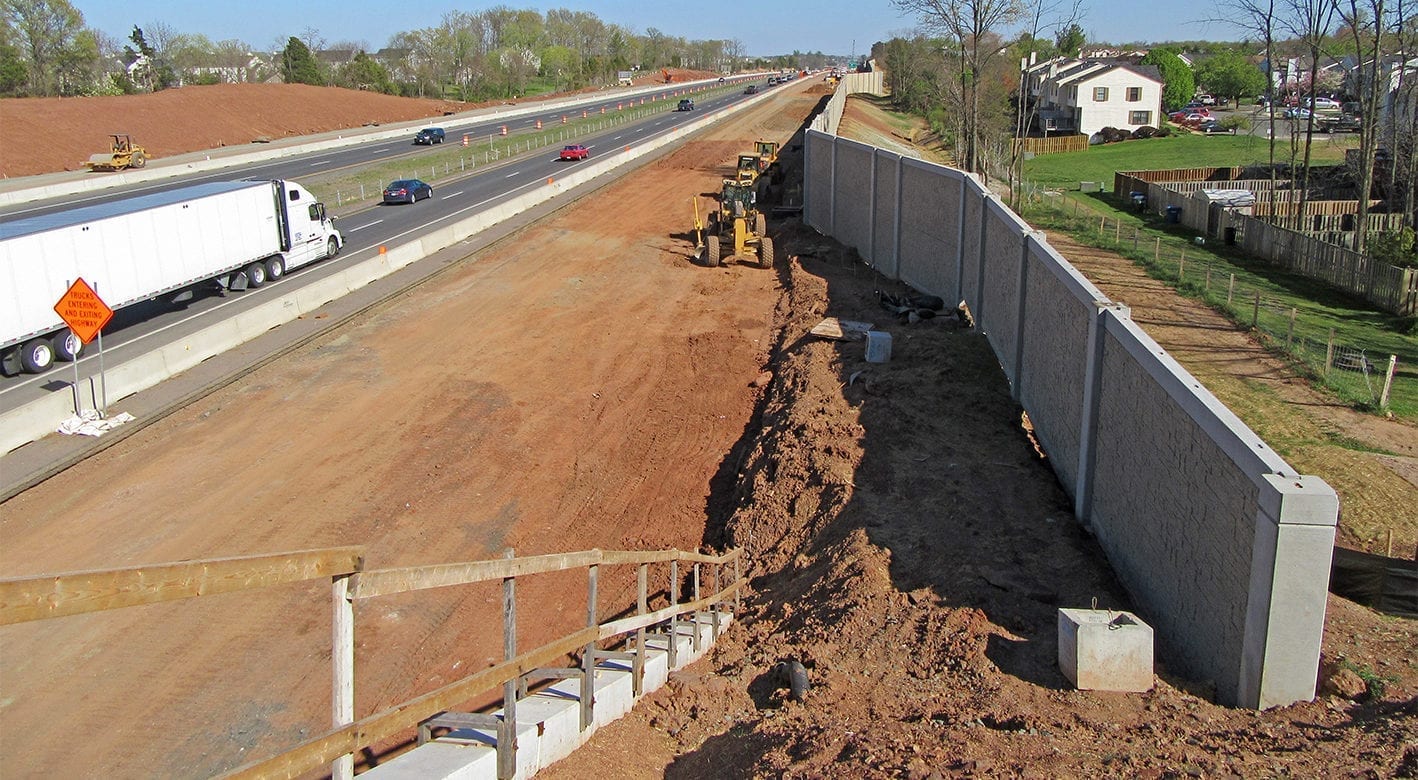 Noise Wall being installed next to a highway