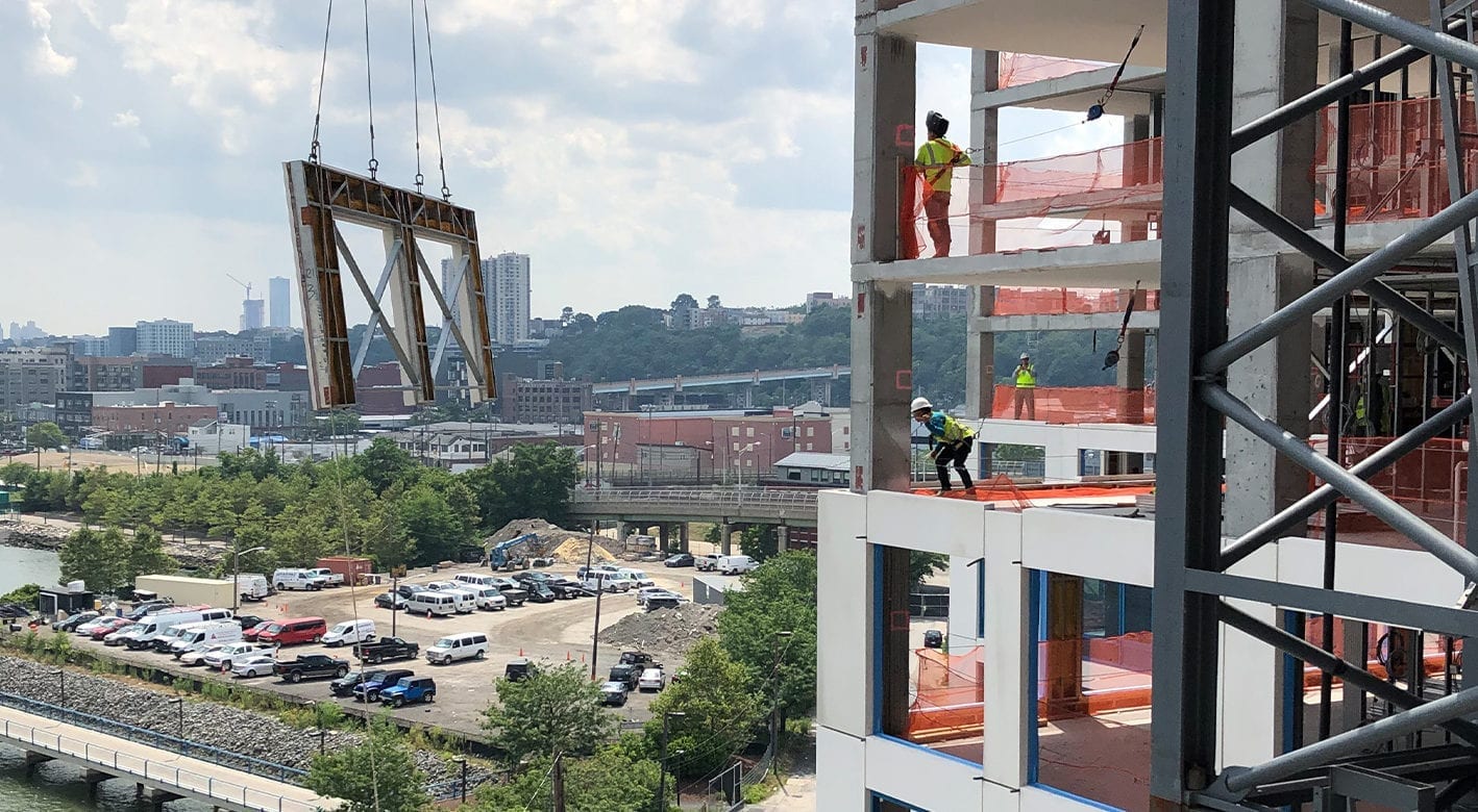 SlenderWall panel being lifted up into place